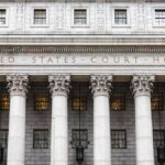 Millions in Pandemic Aid Spark Political Fraud Cases United States courthouse facade with Corinthian columns