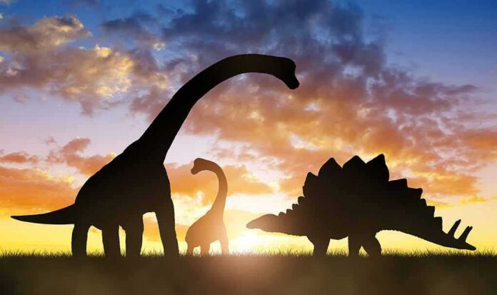 dinosaur silhouettes at sunset