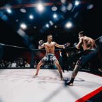 UFC Invades White House—Crowd ERUPTS Two MMA fighters square off in a caged octagon