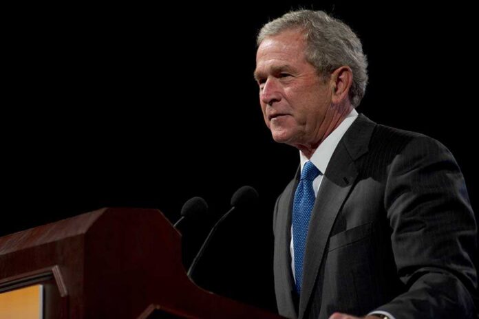 Phoenix,,Az,-,March,16:,Former,President,George,W.,Bush George W. Bush speaking at a podium with microphones