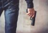Shots Inside Classroom – A Father Charges In person holding a handgun by their side