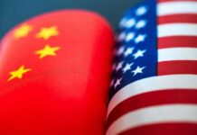 China’s Grip Tightens – Socialist Delegations Exposed Chinese and American flags side by side