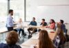 Higher Education Just Got a $3 Billion Surprise Teacher leading a discussion with students in a classroom