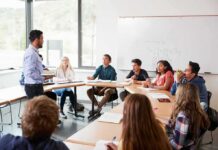 Higher Education Just Got a $3 Billion Surprise Teacher leading a discussion with students in a classroom