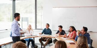 Teacher leading a discussion with students in a classroom