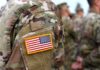 A Post-Election Military Option Comes Into Focus U.S. flag patch on a camouflage military uniform