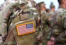 A Post-Election Military Option Comes Into Focus U.S. flag patch on a camouflage military uniform