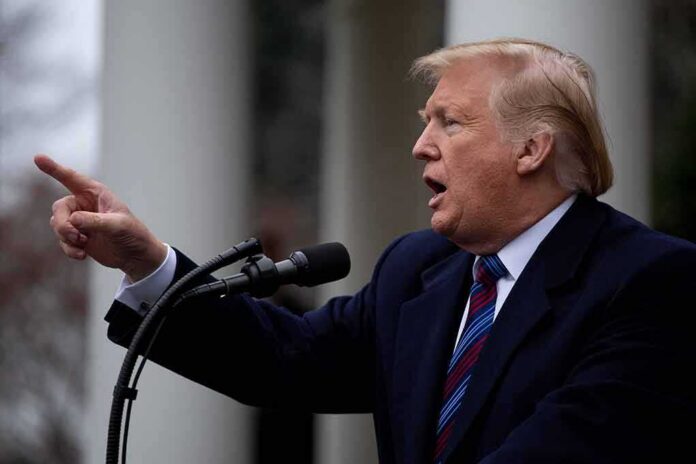 Donald Trump speaking at a podium and pointing