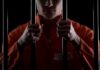 Public Execution Shocks America – Pentagon Greenlights Prisoner in orange jumpsuit gripping jail bars