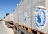 Funding Collapse Triggers Famine Spiral Humanitarian aid trucks loaded with palletized supplies