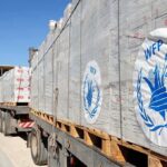 Funding Collapse Triggers Famine Spiral Humanitarian aid trucks loaded with palletized supplies
