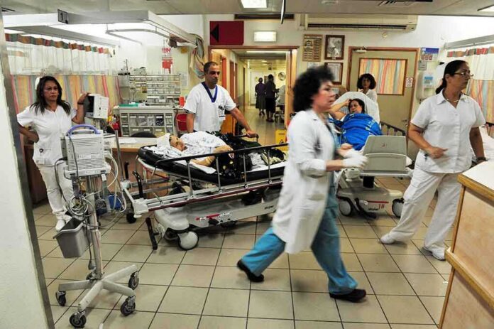 shutterstock_144372544 Hospital emergency room with staff moving patients on stretchers