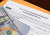 Got a Job? Great. Finding One Is Harder Unemployment benefits application with cash and envelope