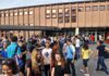 Student Uprising Shuts Paris – Chaos Spreads Students gathered outside a school building entrance