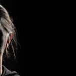 silhouette of a person's face in low-key lighting