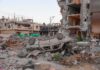 A School Tragedy Puts Military Decisions Under Scrutiny Overturned car amid rubble and heavily damaged buildings