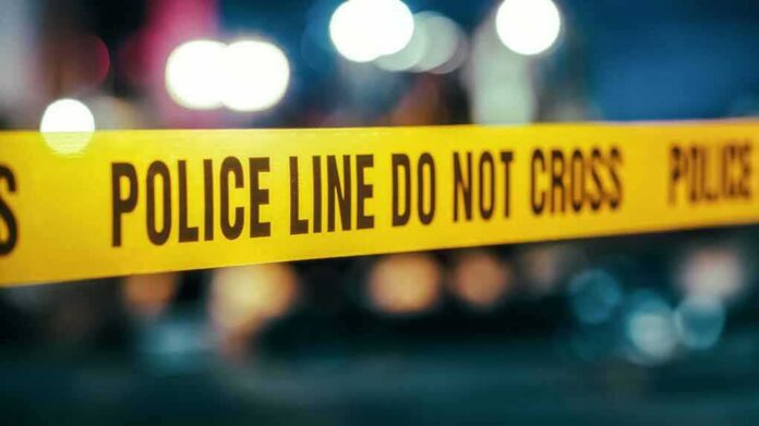 shutterstock_2230645961 Yellow police tape with do not cross warning
