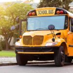 Yellow school bus with stop sign extended
