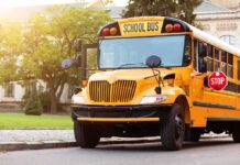 GPS Exposes Shocking NYC Bus Fiasco Yellow school bus with stop sign extended