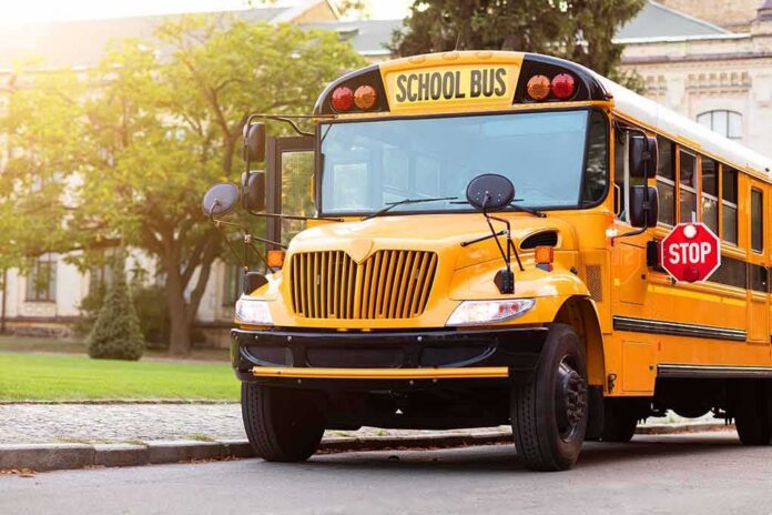 Yellow school bus with stop sign extended