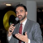 Shots Fired – NYC Takes On Feds Zohran Mamdani speaking into a microphone