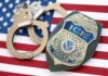 Three Million Leads. Eight Arrests. What Happened? ICE officer badge and handcuffs on an American flag