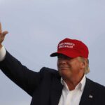 A Presidential Visit Brings Unexpected Spotlight Donald Trump waving in a red cap