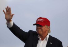 A Presidential Visit Brings Unexpected Spotlight Donald Trump waving in a red cap