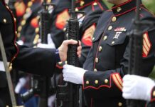 Terror Tactics? Archbishop TORCHES Planned Broadcast Marines in dress uniforms holding rifles during a ceremony