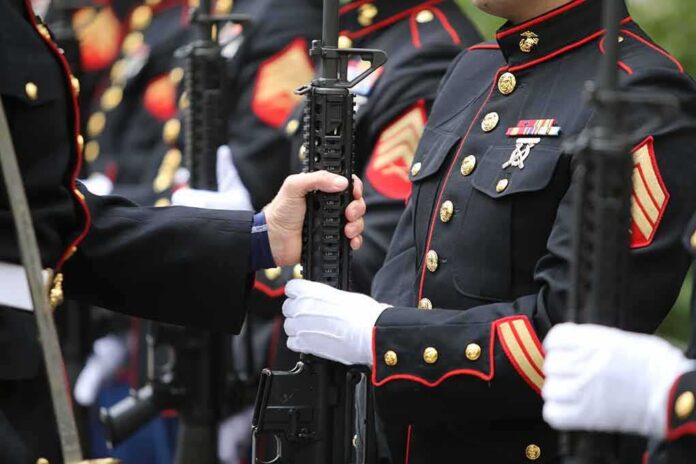 Marines in dress uniforms holding rifles during a ceremony