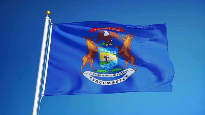 Michigan state flag waving on a flagpole