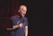 Maher’s Tune Shifts After White House Night Bill Maher performing stand-up with a microphone on stage